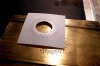 One of the first embossed foils. The large center hole must exist, so that the styrene sheet can better extend.